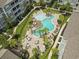 Aerial view of resort-style pool with lounge chairs and patio tables at 149 Ella Kinley Circle # 302, Myrtle Beach, SC 29588