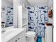 Clean bathroom with white vanity, shower, and fun shark theme at 1501 Saint George Ln., Myrtle Beach, SC 29588