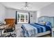 Bright bedroom with a comfortable bed, desk and large window at 1501 Saint George Ln., Myrtle Beach, SC 29588