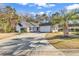 Attractive house exterior with a large driveway and palm trees at 1501 Saint George Ln., Myrtle Beach, SC 29588