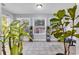 Sunroom with multiple windows, plants, and a relaxing atmosphere at 1501 Saint George Ln., Myrtle Beach, SC 29588