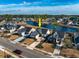 Aerial view of neighborhood homes surrounding a scenic lake with mature trees at 1829 Wood Stork Dr., Conway, SC 29526