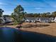 Community homes boast lake access and feature manicured lawns with mature trees at 1829 Wood Stork Dr., Conway, SC 29526