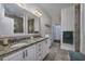 The bathroom has a double sink vanity with granite countertop and tiled floor at 1829 Wood Stork Dr., Conway, SC 29526