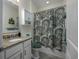 The bathroom features a vanity with granite countertops and shower/tub combo at 1829 Wood Stork Dr., Conway, SC 29526