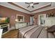 The well-lit bedroom features beautiful hardwood floors and direct access to the bathroom at 1829 Wood Stork Dr., Conway, SC 29526