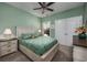 This stylish bedroom features bright green walls and a large window at 1829 Wood Stork Dr., Conway, SC 29526