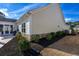 View of the home's exterior featuring manicured landscaping, a stone foundation, and siding at 1829 Wood Stork Dr., Conway, SC 29526