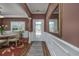 Inviting foyer with hardwood floors, decorative molding, and a view of the dining area at 1829 Wood Stork Dr., Conway, SC 29526