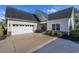 Spacious two-car garage with an extra-wide driveway and manicured landscaping at 1829 Wood Stork Dr., Conway, SC 29526