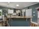 Well-lit kitchen featuring modern appliances, granite countertops, and bar seating at 1829 Wood Stork Dr., Conway, SC 29526
