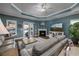 Cozy living room with a fireplace, tray ceiling, and access to the outdoor patio at 1829 Wood Stork Dr., Conway, SC 29526
