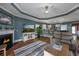 Open-concept living area with a fireplace, entertainment center, and adjacent kitchen and dining spaces at 1829 Wood Stork Dr., Conway, SC 29526