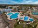 Aerial view of the community pool, with a water slide, and a splashpad at 1829 Wood Stork Dr., Conway, SC 29526