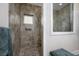 This tiled walk-in shower features dual shower heads and a glass enclosure at 1829 Wood Stork Dr., Conway, SC 29526