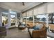 Relax in the sunroom with tranquil water views, featuring wicker chairs and natural light at 1829 Wood Stork Dr., Conway, SC 29526