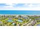 Aerial view of oceanfront community with tennis courts and pool at 203 Heron Marsh Dr. # 78, Pawleys Island, SC 29585