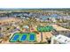 Aerial view of community amenities, including tennis courts and a pool at 203 Heron Marsh Dr. # 78, Pawleys Island, SC 29585