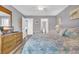 Spacious bedroom with a king-size bed and plenty of natural light at 203 Heron Marsh Dr. # 78, Pawleys Island, SC 29585