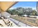 Relaxing deck overlooking trees and a quiet street at 203 Heron Marsh Dr. # 78, Pawleys Island, SC 29585