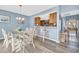 Bright dining area with seating for four and kitchen access at 203 Heron Marsh Dr. # 78, Pawleys Island, SC 29585