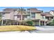 Attractive condo building with a spacious driveway and lush landscaping at 203 Heron Marsh Dr. # 78, Pawleys Island, SC 29585