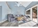 Bright living room with hardwood floors and access to a deck at 203 Heron Marsh Dr. # 78, Pawleys Island, SC 29585