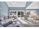 Bright living room with sliding doors to deck and ocean views at 203 Heron Marsh Dr. # 78, Pawleys Island, SC 29585