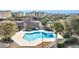 Resort-style pool with surrounding buildings and tennis courts at 203 Heron Marsh Dr. # 78, Pawleys Island, SC 29585