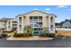 Nice condo building with palm trees and parking at 212-C Landing Rd. # 212-C, North Myrtle Beach, SC 29582