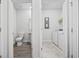 Modern bathroom and laundry room with grey flooring and white cabinets at 2602 Blue Crane Circle # 101, Myrtle Beach, SC 29577