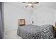 Comfortable bedroom features a ceiling fan, double door closet, and a bed with patterned bedding at 2602 Blue Crane Circle # 101, Myrtle Beach, SC 29577