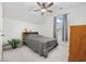 Inviting bedroom boasts a ceiling fan, window with curtains, and a cozy bed with patterned bedding at 2602 Blue Crane Circle # 101, Myrtle Beach, SC 29577