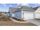 Charming home shows an attached garage, manicured landscaping, and a walkway to the front entrance at 2602 Blue Crane Circle # 101, Myrtle Beach, SC 29577