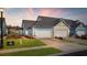 Evening view of the home's exterior and driveway at 2602 Blue Crane Circle # 101, Myrtle Beach, SC 29577