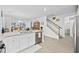 Open kitchen area with granite island, stainless steel dishwasher, and staircase leading to upper level at 2602 Blue Crane Circle # 101, Myrtle Beach, SC 29577