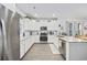 Bright kitchen featuring white cabinets, granite countertops, stainless steel appliances and modern finishes at 2602 Blue Crane Circle # 101, Myrtle Beach, SC 29577