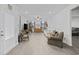 Spacious living room with wood-look floors, neutral walls, and ample natural light at 2602 Blue Crane Circle # 101, Myrtle Beach, SC 29577