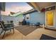 Back patio with comfortable seating and a view of a fenced backyard at 2602 Blue Crane Circle # 101, Myrtle Beach, SC 29577
