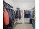 Walk-in closet with metal shelving and wood-look floors at 2602 Blue Crane Circle # 101, Myrtle Beach, SC 29577