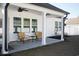 A covered back patio featuring comfortable seating and serene outdoor space at 261 Marsh Tacky Loop, Myrtle Beach, SC 29588