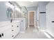 Well-lit bathroom featuring a glass shower, dual sink vanity, and a large walk-in closet at 261 Marsh Tacky Loop, Myrtle Beach, SC 29588
