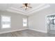 Spacious bedroom features a tray ceiling, ceiling fan, recessed lights and a door to a bathroom at 261 Marsh Tacky Loop, Myrtle Beach, SC 29588