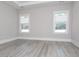 Bedroom featuring light grey paint, large windows and neutral blinds at 261 Marsh Tacky Loop, Myrtle Beach, SC 29588