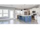 Stylish kitchen with stainless appliances, a blue island, and white subway tile backsplash at 261 Marsh Tacky Loop, Myrtle Beach, SC 29588