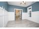 Stylish living room featuring modern wainscoting and sliding barn doors, enhancing the home's appeal at 261 Marsh Tacky Loop, Myrtle Beach, SC 29588