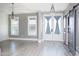 Open living area featuring natural light, barn doors, and wood-look floors at 261 Marsh Tacky Loop, Myrtle Beach, SC 29588