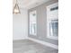 Living room with natural light, neutral gray and white decor, and modern lighting fixture at 261 Marsh Tacky Loop, Myrtle Beach, SC 29588
