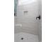 Detailed view of a tiled shower with a recessed shower caddy, black hardware, and a tiled bench at 261 Marsh Tacky Loop, Myrtle Beach, SC 29588