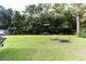 Large backyard with a grassy area and trees at 3657 Highway 472, Conway, SC 29526
